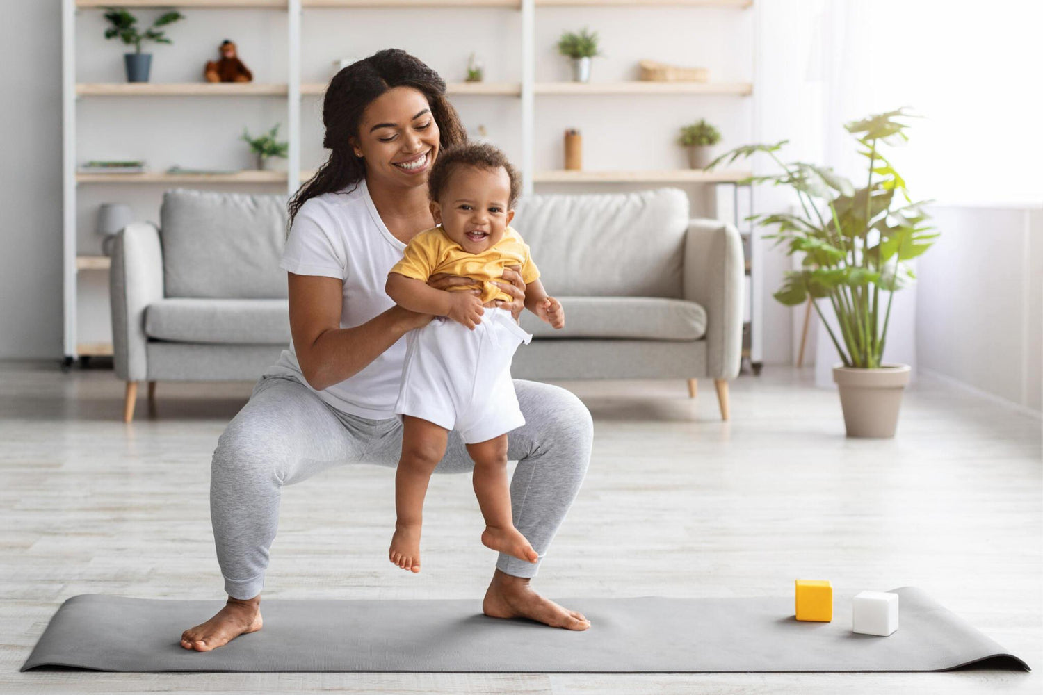 Mother holding a baby with baby needs