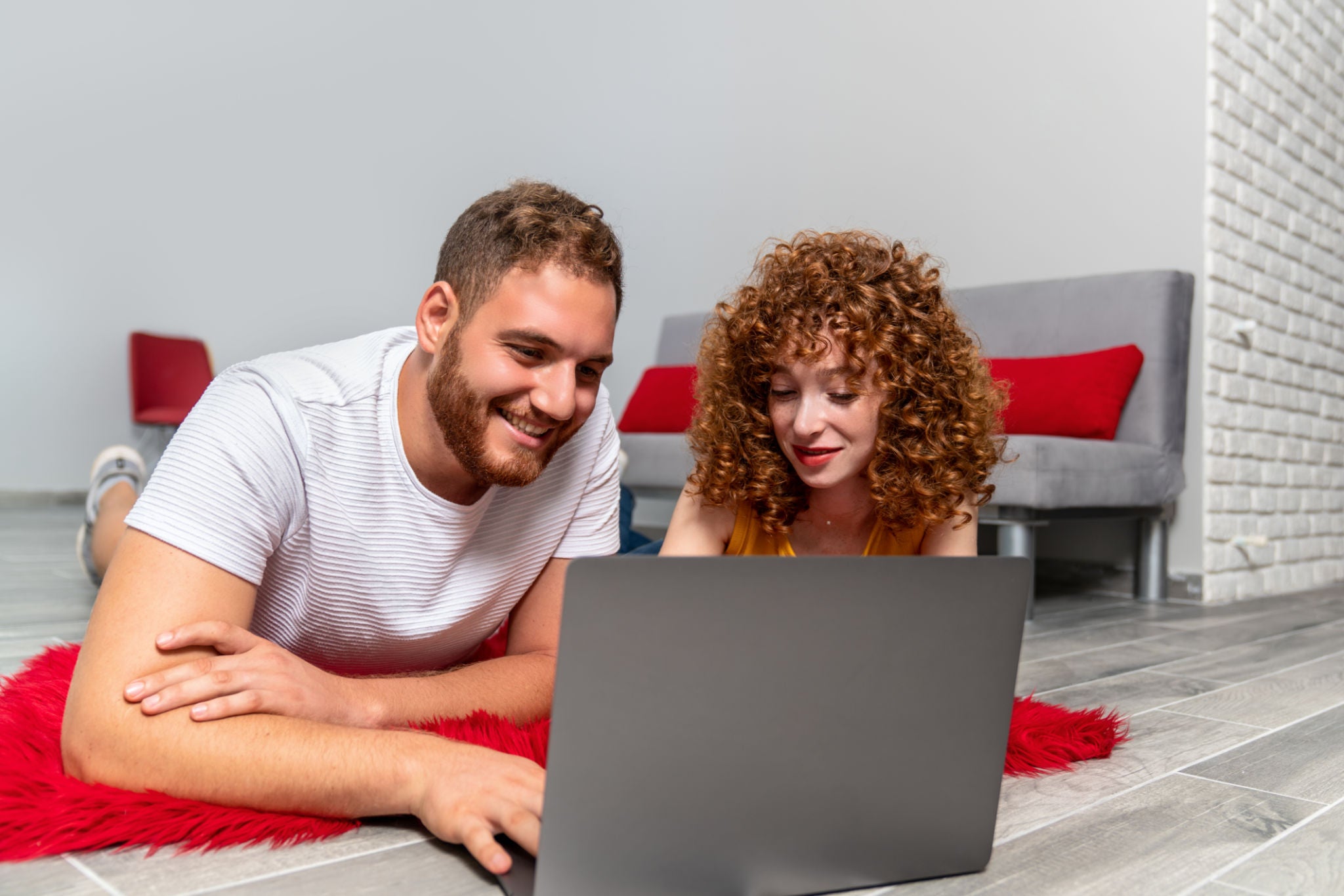 A couple using smart electronics